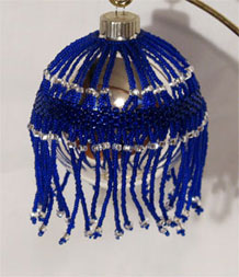 Cobalt belted Victorian Christmas ornament
